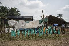 Clothing for health workers is set out to dry at the MSF transit centre in Itipo.