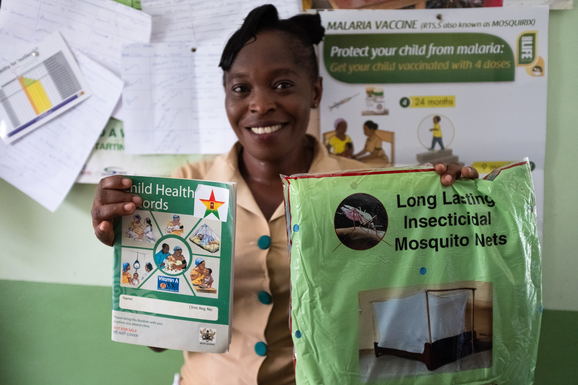 Children vaccinated against malaria in Ghana have a star sticker label on their record book