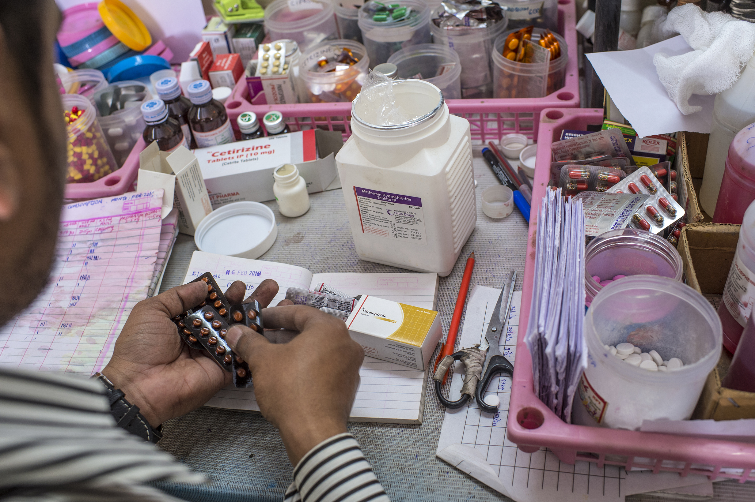 man manipulating medicines