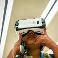 A visitor trying virtual reality glasses
