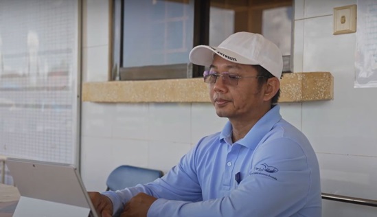 A health worker stills in front of a tablet communicating with his patients